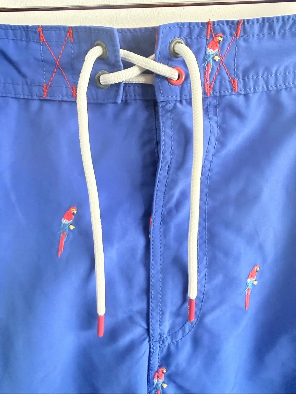 Tommy Bahama Blue Swim Trunks with Red Parrot Embroidery